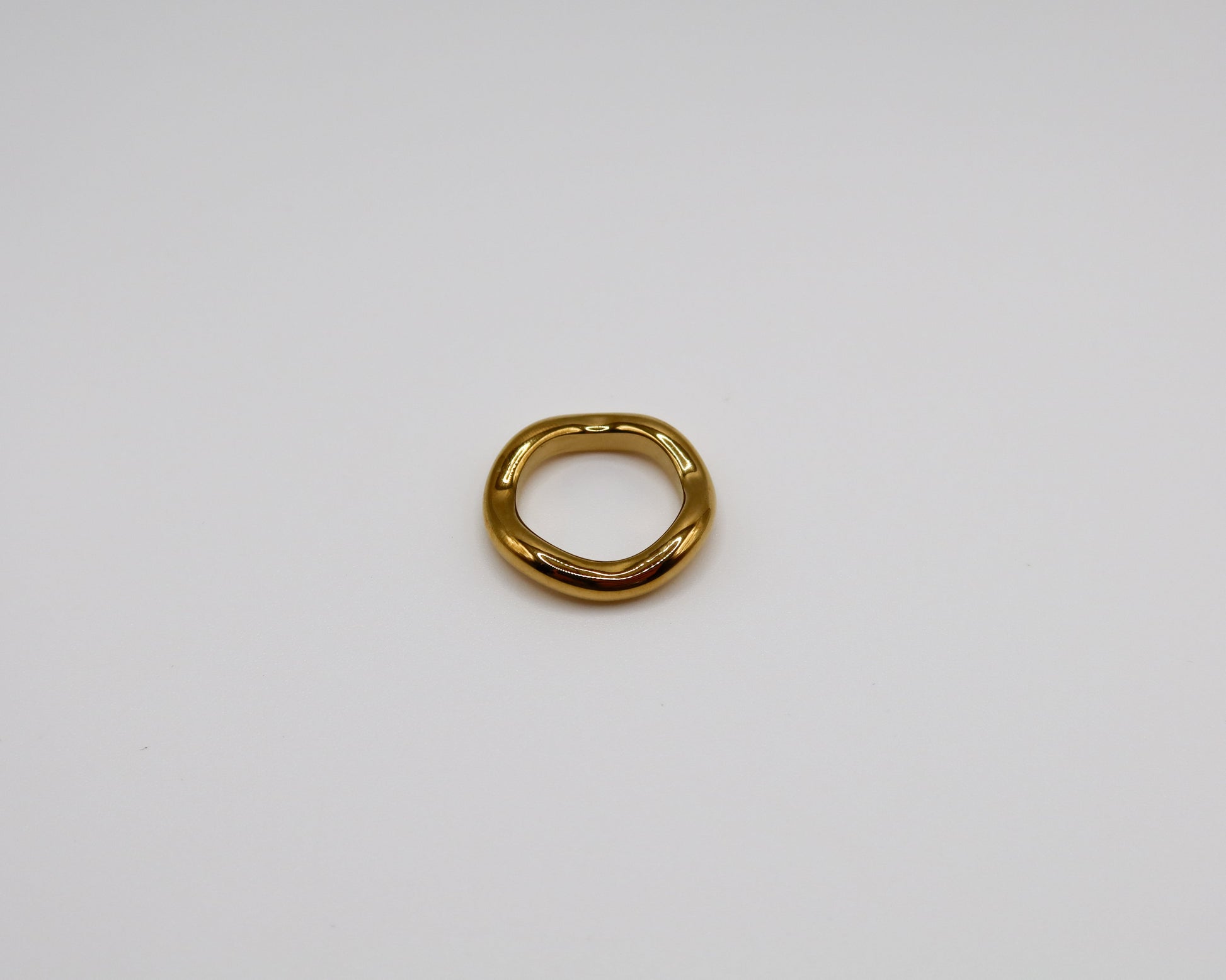 Gold ring on a white background