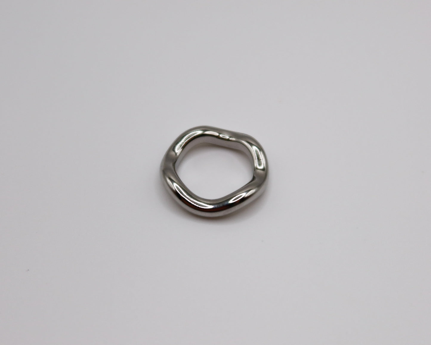 Metallic ring on a light gray background