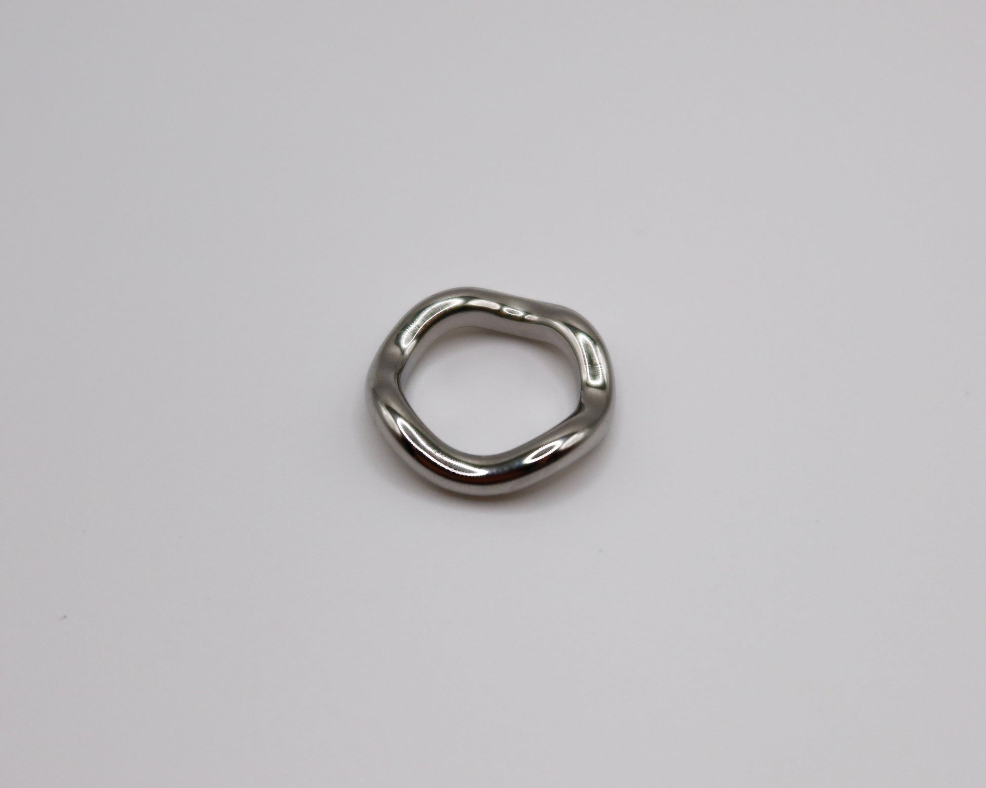 Metallic ring on a light gray background